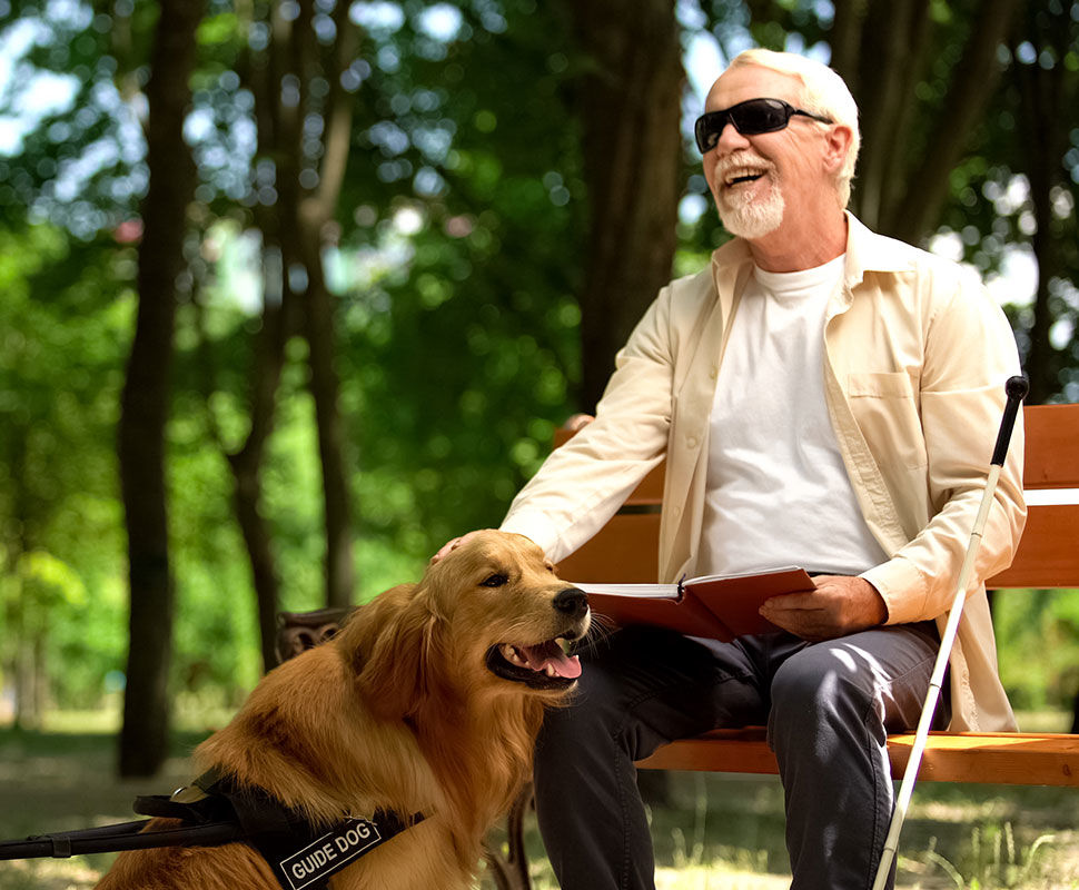 Blind man happy with his guide dog